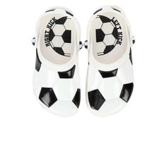 a pair of white and black shoes with soccer balls on the front, side view