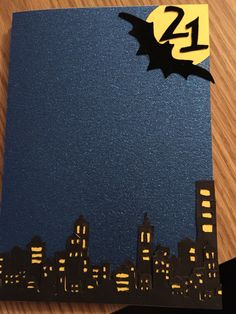 a batman themed birthday card with the number 24 on it and cityscape in the background