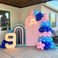 balloon arch for birthday party in front of house