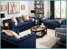 a living room filled with blue couches and chairs