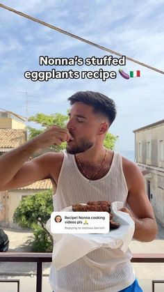 a man eating food on top of a plate with an italian flag in the background