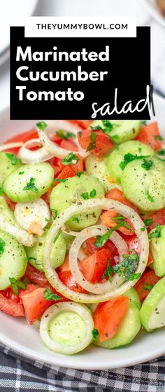 a white plate topped with cucumber and tomato salad