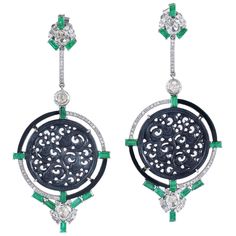 These stunning carved Jade earrings are meticulously crafted from 18 Karat gold and sterling silver. It is hand set in 30.0 carats Jade, 3.13 carats emerald and 2.23 carats of sparkling diamonds. FOLLOW MEGHNA JEWELS storefront to view the latest collection & exclusive pieces. Meghna Jewels is proudly rated as a Top Seller on 1stDibs with 5 star customer reviews. All items manufactured by us are handmade and can be customized or redesigned. Composition Size-80X35 MM Total Weight-24 Gold Weight(Gms)-1.76 Silver Weight(Gms)-13.708 Diamond Wt(Cts)-2.23 Emerald Wt(Cts)-3.13 Jade Wt(Cts)-30 Luxury Carved Earrings For Formal Occasions, Luxury Carved Earrings, Elegant Carved Earrings For Formal Occasions, Luxury Earrings With Intricate Design, Carved Diamond Fine Jewelry, Fine Carved Diamond Jewelry, Elegant Round Carved Earrings, Elegant Carved Round Earrings, Luxury Intaglio Jewelry For Evening