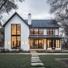 a white house with black trim and windows