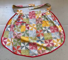 "Want your favorite quilt pattern in the kitchen?  Here's your chance with this fun vintage apron!  Cute half apron is made from fabric made to look like quilting squares.  Trimmed in red bias.  One pocket. Made of cotton, this measures 21\" from waist to hem, 41\" from the end of one tie to the end of the other.  No stains or holes. Check out my other vintage aprons:  https://www.etsy.com/shop/unclebunkstrunk?ref=hdr_shop_menu&search_query=apron" Quilting Squares, Apron Cute, Grandmothers Flower Garden, Vintage Aprons, Vintage Apron, Vintage Poodle, Vintage Tea Towels, Cabbage Roses, Half Apron