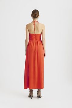 The Gestuz Alica Maxi Dress in cherry tomato will make you look good enough to eat! The flattering halter neck followed by a triangle cutout between the busts will leave you looking scrumptious. Summer Cocktail Halter Maxi Dress, Orange Halter Neck Maxi Dress For Evening, Orange Halter Neck Dress For Cocktail, Spring Red Halter Dress For Cocktail, Red Halter Dress For Summer Cocktail, Red Halter Summer Cocktail Dress, Elegant Orange Halter Neck Maxi Dress, Red Summer Cocktail Halter Dress, Red Halter Neck Maxi Dress For Brunch