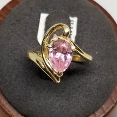 Z2119 Vintage 14K Yellow Gold Ring with a Pink Ice Diamond, Size 5.75, Damaged. Surface has chips and scratches. Marked 14K inside band. Stone is 8 x 6mm. Ring is 16mm wide. Weighs 2.6 dwt. We do not check prongs for wear or stones for looseness. All items are sold as is-noting that we are a resale shop so everything here had a previous owner! We will include flaws in the description when noted. This is one of the reasons our items are more affordable than new at a jewelry store. Are these stones real or fake? Aside from diamonds, we do not know if any gemstones are natural or synthetic. We will state on certain gemstones, that we know 100%, if they are created or fake due to their lack of inclusions. For this reason, we do not sell any diamonds without inclusions, and the larger diamonds Collectible Yellow Gold Rings With Accent Stones, Teardrop Hallmarked Ring For Anniversary, Hallmarked Teardrop Anniversary Ring, Formal Pink Gold Sapphire Ring, Gold Pear-shaped Topaz Gemstone Ring, Pear-shaped Ring As Gift, Formal Yellow Gold Topaz Teardrop Ring, Pink 14k Gold Pear-shaped Jewelry, Pink Pear-shaped 14k Gold Jewelry