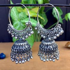 Perfect with ethnic & traditional wear. Fancy Party Wear Traditional Jhumki Earrings. Perfect gift for any occasion for yourself and your dear ones. It is advisable to store jewellery in a zip lock pouch (air tight pouch), keep away from water perfume and other chemicals and clean it with dry and soft cloth. Festive Chandbali Metal Plug Earrings, Festive Metal Hoop Earrings In Temple Jewelry Style, Traditional Oxidized Hoop Earrings For Festive Occasions, Silver Dangle Earrings With Bells, Dangle Metal Chandbalis With Latkans, Dangle Chandbalis With Latkans In Metal, Chandbali Earrings With Bells For Festivals, Traditional Metal Hoop Earrings For Celebration, Metal Chandbali Danglers For Pierced Ears