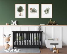 a baby's room with green walls and pictures on the wall, including a crib