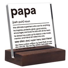 a wooden block with a sign on it that says papa