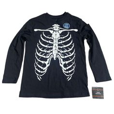 Child’s Halloween Skeleton Bones Black Long Sleeve T-Shirt Size M 8/10 New With Tags Fitted Long Sleeve Halloween T-shirt, Unisex Black Tops With Skull Print, Unisex Halloween Graphic Print Top, Unisex Graphic Print Top For Halloween, Casual Black Glow In The Dark Top, Black Cotton Top With Glow In The Dark Details, Black Glow In The Dark Crew Neck Top, Halloween Glow In The Dark Black Top, Pink Tee Shirt