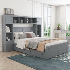 a bedroom with a bed, desk and bookcases on the wall next to it