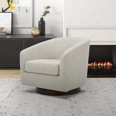 a white chair sitting in front of a fire place