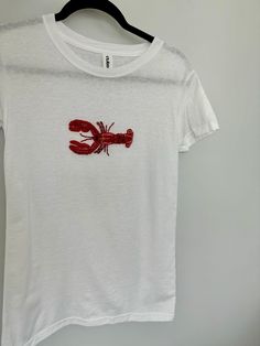 Hand embroidered lobster shirt, 8 hours of work each bead is sewn by hand. Truly a labor of love. All done by hand with glass bead details, expect variations since this is a custom piece. Soft stretchy tshirt material.  Please expect 5-7 days to be completed and shipped. Rush orders can be requested for an extra fee, please message me to inquire.  -Sizes are US Women Made with love always <3 *Hand wash ideally or machine was on delicate inside out in a garment bag. Hang to dry. Beaded Lobster, With Love Always, Lobster Shirt, Beaded Shirt, Embroidery T Shirt, Embroidery Tshirt, Embroidered Tee, Embroidered Skirt, Tee Shirt Designs