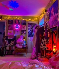 a bedroom with lights and posters on the walls