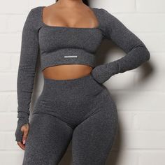 Beautiful Fashion Nova Brand Grey Long Sleeve Athletic Wear Workout Shirt Featuring: Thick Knit Material, Square Neckline & Cropped Length. Quality Material That Is Comfortable, Form Fitting & Really Hugs Those Curves. Pants Not Included. Size: S Condition: Like New 62% Nylon 29% Polyester 9% Spandex Ships In 2-3 Days Gray Stretch Crop Top For Workout, High Stretch Gray Crop Top For Workout, Stretch Gray Crop Top For Yoga, Gray High Stretch Crop Top For Workout, Gray Stretch Crop Top For Yoga, Fitted Gray Crop Top For Workout, Gray Stretch Tops For Yoga, Fitted Gray Sportswear Tops, Gray High-stretch Yoga Top