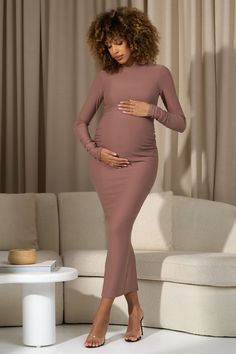 Curate a wardrobe of premium maternity basics starting with Dove. Designed in a warm taupe shade. this long-sleeve maxi is cut from a super soft brushed jersey that effortlessly caresses each curve. Complete with subtle bump ruching and a functional split hemline for ease of movement. Dove is the perfect day to night piece. Features - Premium stretch brushed jersey - Bodycon fit - Crew neckline - Long sleeves- Bump ruching- Invisible zip closure - Split hemline- Maxi length Sizing & Fit Model is Maternity Basics, Warm Taupe, Club L London, Maternity Maxi Dress, Black Dress Prom, Black Tie Gala, Maternity Maxi, Party Dress Long Sleeve, Christmas Party Dress