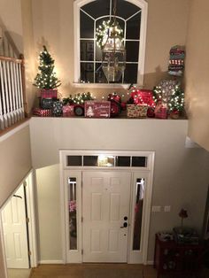 a christmas scene with presents on top of the door