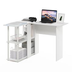 a laptop computer sitting on top of a white desk