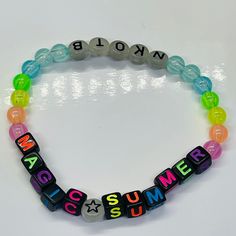 Glow in the dark acrylic beaded bracelet . BH LOVE bracelet that celebrates the nostalgia of The magic Summer Tour in fun glow in dark neon colors.   block letter colors May vary ️ best fits 5- 6" wrists Adjustable Neon Yellow Summer Jewelry, Rainbow Adjustable Beaded Bracelets For Rave, Adjustable Rainbow Beaded Bracelets For Rave, Trendy Neon Beaded Bracelets For Gifts, Rainbow Magic, Glo Up, Summer Tour, New Kids On The Block, Kids On The Block