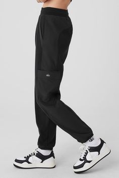 Made from a fleecy-soft fabric with smooth, contrasting panels down the legs, these pants are every bit as cozy as they look. They have a total of 4 pockets—2 on the sides, 2 on the legs—plus a stretchy high-rise waistband and stretchy cuffed hems for a jogger-style fit. Our advice? Get the matching jacket, too. Casual Jogging Bottoms With Functional Pockets, Alo Yoga Pants With Pockets, Alo Yoga Relaxed Fit Pants With Pockets, Alo Yoga Athleisure Pants With Pockets, Urban Black Pants With Ribbed Waistband, Sporty Straight Leg Pants With Functional Pockets, Techwear Jogging Bottoms With Pockets, Functional Black Joggers With Ribbed Waistband, Techwear Bottoms With Pockets For Jogging