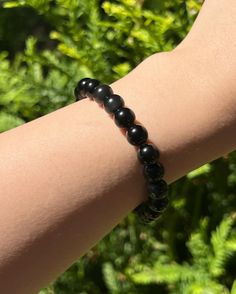 ✈ FREE SHIPPING ORDERS $35+  ❤ Buy 3 items and get 5% extra off! ❤ Buy 5+ items and get 10% extra off, Use code: EXTRA10 ❤ Buy 10+ items and get 20% extra off, Use code: EXTRA20 Unlock the power of protection and strengthen your spirit with our exquisite Black Obsidian Bracelet. Known as the Stone of Protection, Black Obsidian is highly regarded for its ability to block, absorb, and transform negative energy. This bracelet not only enhances your spiritual clarity but also fosters feelings of confidence, grounding, and inner strength. ❤ Material: Natural Black Obsidian beads. ❤ Bead Size: Available in 6mm and 8mm. ❤ Bracelet Length: 6-10 inches, adjustable upon request. The bracelet is stretchable, providing a comfortable fit for daily wear. Custom sizes are available--just specify in the p Spiritual Obsidian Crystal Bracelet Gift, Spiritual Beaded Obsidian Bracelets, Black Obsidian Round Crystal Bracelet, Hand-strung Obsidian Beaded Bracelets As Gift, Hand-strung Obsidian Bracelet, Black Obsidian Bracelet, Energy Jewelry, Obsidian Bracelet, Black Obsidian