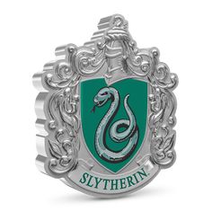 the slythern crest is shown in silver and green with a snake on it