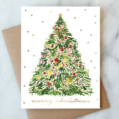 a christmas card with a watercolor tree on it