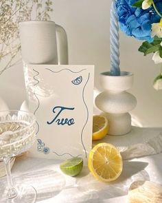 there is a card with the word trueo on it next to some lemons