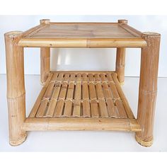 a small bamboo table with one shelf on top