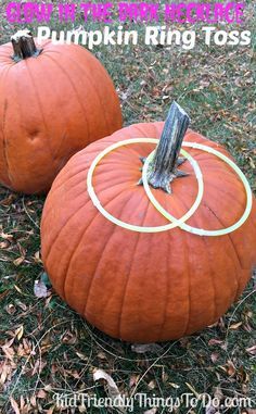 two pumpkins sitting in the grass with their rings on them and text overlay that reads how to stick necklaces into pumpkin ring toss