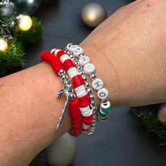 Festive Christmas Bracelet Stack - "Ho Ho Ho" Beaded Holiday Bracelet Set Bring a cheerful touch to your holiday style with this vibrant Christmas bracelet stack! Featuring four unique bracelets in classic holiday colors of red, white, and green, this festive stack is perfect for spreading Christmas spirit wherever you go. Each bracelet is made from high-quality beads, with a fun mix of designs that include striped, solid, and multi-colored patterns, creating a delightful holiday-themed look. Features: "Ho Ho Ho" Bead Design: This stack includes a focal bracelet with white beads spelling out "Ho Ho Ho," adding a playful nod to Santa's iconic laugh. It's perfect for anyone who loves celebrating the season! Holiday Color Palette: With a harmonious blend of red, green, and white beads, these Holiday Color Palette, Holiday Bracelet, Beaufort Nc, Holiday Bracelets, Bracelet Stacks, Halloween Bracelet, Diy Bracelet Designs