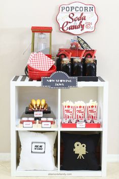 the popcorn bar is set up with red and black items