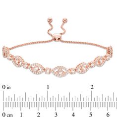 Top off any dressy look with this glamorous gemstone bolo bracelet. Fashioned in sterling silver with 18K rose gold plate, this flattering design features 3.5mm soft-pink morganites wrapped in open marquise-shaped frames lined with lab-created shimmering white sapphires. Alternating 3.0mm soft-pink morganites complete this delightful style. Buffed to a brilliant luster, this wheat chain bracelet adjusts up to 9.0 inches in length and secures with a bolo clasp and ball ends. Elegant Adjustable Diamond Bracelet For Party, Adjustable Rose Gold Diamond Bracelet, Adjustable Rose Gold Jewelry With Diamond Accents, Elegant Diamond Gemstone Bracelet For Party, Elegant Rose Gold Bracelets With Gemstones, Elegant Adjustable Length Jewelry For Anniversary, Adjustable Rose Gold Diamond Bracelet For Parties, Elegant Adjustable Oval Diamond Bracelet, Elegant Adjustable Diamond Bracelet For Anniversary