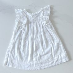 So Sad We Never Got To Wear This! My Youngest Daughter Grew Out Of The Size Before We Could Use It. Very Soft Cotton And Viscose Blend With A Gauzy Look. Intricate Embroidered Detail And Fabric Covered Buttons. Smoke Free, Pet Friendly Home. Cotton Flutter Sleeve Dress For Playdate, White Flutter Sleeve Dress For Playdate, White Flutter Sleeve Playtime Dress, Cotton Ruffle Sleeve Dress For Dress-up, Cotton Ruffle Sleeve Dress, White Playful Flutter Sleeve Dress, Playful White Flutter Sleeve Dress, Cotton Dress With Ruffle Sleeves For Dress-up, Playdate Flutter Sleeve Dress