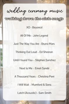 the wedding ceremony music is displayed in front of a table with white linens and chandeliers