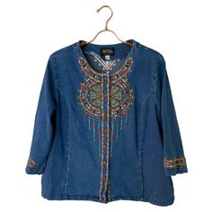 Vintage Bob Mackie Wearable Art Embroidered Denim Shirt Jacket Boho Hippie Festival Wear Such a cute top and so versatile! Heavy shirt/light jacket. Wear as a light jacket over a top, wear as pictured or belt it for a more fitted look.  Embroidered dream catcher design, logo on buttons, side pockets.  Excellent vintage condition, item comes from smoke free and pet free home.  Tagged size large, see measurement pics for sizing help. All items in my shop are sold AS-IS and there are no returns, pl Embroidered Relaxed Fit Denim Jacket, Embroidered Denim Tops For Fall, Fall Embroidered Denim Tops, Casual Denim Jacket With Multicolor Embroidery, Bohemian Medium Wash Denim Top For Fall, Bohemian Embroidered Denim Tops, Blue Long Sleeve Denim Jacket For Festival, Blue Bohemian Long Sleeve Denim Top, Medium Wash Long Sleeve Embroidered Denim Top