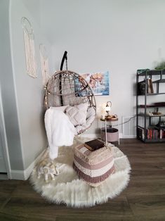 a bedroom with a bed, ottoman and other items on the floor in front of it