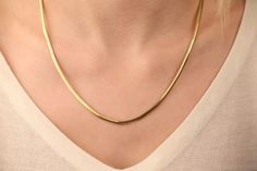 Our snake chain necklace is 14k solid gold. With its minimalist style, you can wear it every day and it fits your all outfit. It is a modern and trendy necklace.  It looks very stylish both alone and when combined with other necklaces. If you consider this gold snake chain as a gift, it makes your loves happy on their birthdays, anniversaries, graduations, mother's day, valentine's day, or women's day. 🎁 We can add a gift note for your loved ones. It arrives in a special jewelry gift box.  ✨ We respond to your questions happily. Your question will be answered within 24 hours. Do not hesitate to contact us. 💎 I hope you have a lot of Onseva's designs. :) lzm Minimalist Herringbone Necklace With Box Chain As Gift, Minimalist 14k Gold Snake Chain Necklace Gift, 14k Gold Box Chain Herringbone Necklace For Gift, 14k Gold Herringbone Box Chain Necklace For Gift, Minimalist Snake Chain Necklace For Anniversary, 14k Gold Herringbone Necklace With Box Chain As Gift, Minimalist Yellow Gold Snake Chain Necklace As Gift, 14k Gold Herringbone Necklace With Box Chain, Classic 14k Gold Snake Chain Necklace As A Gift