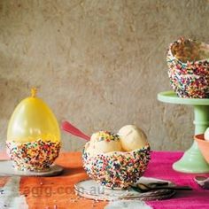 an assortment of ice creams with sprinkles in bowls on a table