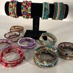 These beaded bracelets look like a pretty stack on your arm and add that extra glamour to your outfit.  Please see the pic with the letters next to each bracelet to make sure you're selecting the one(s) you want.  Easy on, easy off, and it retains its shape nicely (unless, of course, you let your toddler stretch it out straight!  Don't do that!  LOL). If you're new to memory wire, watch the video to see how easy it is to put on and take off. Wire Beaded Bracelets, Memory Wire, Daughter Love, The One, Jewelry Bracelets, Handmade Items, Bangles, Beaded Bracelets, Things To Come