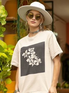 Discover the timeless elegance of nature with our OVERSIZED T-Shirt Vintage Orchid Flowers Tee. This unisex drop-shoulder t-shirt features a lush, vintage-inspired orchid flower print, seamlessly blending the allure of botanical art with the laid-back vibe of modern streetwear. Perfect for those who appreciate the beauty of flowers and the charm of retro aesthetics, this tee is a celebration of floral magnificence and artistic expression. -  Lush Orchid Design: Adorned with a vintage print of or Botanical Screen Print Short Sleeve T-shirt, Artistic Short Sleeve Relaxed Fit Tops, Artistic Relaxed Fit Short Sleeve Tops, Artistic Relaxed Fit T-shirt For Spring, Botanical Short Sleeve Top With Screen Print, Botanical Screen Print Short Sleeve Tops, Artistic Short Sleeve T-shirt For Spring, Botanical Crew Neck T-shirt With Relaxed Fit, Artist Vibes