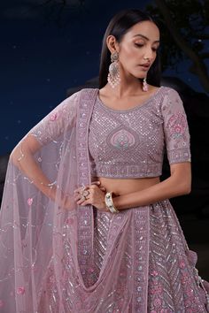 Looking to stun the crowd at your wedding? Our bridal lehenga features a glorious georgette fabric, showered with delicate sequins work. The semi-stitched lehenga boasts an easy-to-adjust drawstring closure, giving you an elegant fit that perfectly suits your frame. Pack comes with a beautifully coordinated unstitched choli and matching dupatta to complete the bridal look. The choli design features half sleeves to balance elegance with comfort. Purple Dupatta, Heavy Lehenga, Bridesmaid Lehenga, Purple Bottom, Purple Soft, Long Kaftan, Choli Designs, Silk Bottoms, Heavy Embroidery