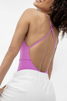 An open back, plunging front, super soft straps, no dig hem - this sweat ready playsuit keeps you looking and feeling held together. Paired with California Love Cotton Field Day sweatpants in Coconut. Playful Sleeveless Cotton Onesie, Compressive Seamless Solid Unitard, Playful Blue Sleeveless Onesie, Purple Cotton Playwear Sets, Yellow Short Sleeve Playwear Set, Cotton Fields, Field Day, California Love, Playsuit