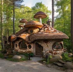 a house made out of rocks and mushrooms in the woods