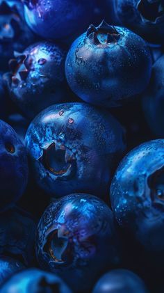 some blueberries are sitting together in the dark