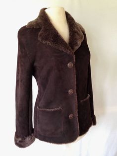 "Luscious, luxurious  shearling jacket, dark chocolate, slim flattering fit.  Just back from cleaning by a specialist--$95. The exterior is so finely sueded, it feels like velvet. It is in excellent condition. Can't go to Barneys and lay out $2500 for one like this?   Sssh-- I'll never tell! US size 7 Flat measurements: Shoulders 18\", circumference at underarm 40\", sleeve with cuffs rolled up, 24.5\", back neck length 26\". Free shipping continental USA" Fitted Classic Sheepskin Fur Coat, Fitted Sheepskin Fur Coat, Fitted Brown Sheepskin Outerwear, Fitted Brown Sheepskin Fur Coat, Classic Fitted Leather Jacket With Faux Fur Lining, Fitted Brown Leather Jacket With Faux Fur Trim, Barneys New York, Shearling Jacket, Fur Jacket