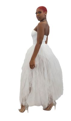 Beautifully designed, this flirty strapless off white dress features a smooth fabric body suite paired, sweetheart neckline, and a layered tulle skirt. Includes zip enclosure on the back. Model is wearing a size small. Dress With Tulle Skirt, Off White Dress, Dress With Tulle, Back Model, Layered Tulle Skirt, Off White Dresses, Sweetheart Neckline, Tulle Skirt, Strapless Dress