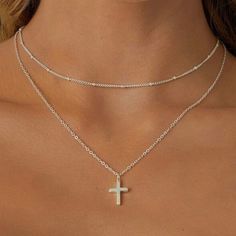 Cross Necklace. Women’s And Girls Jewelry. Stainless Steel Metal. Silver Color. Two Necklaces In One. One Plain Chain With A Cross Pendant. Other Necklace Is A Shorter Chain Attached That Has Small Detailing Throughout. Clasp Closure With Extender At The Ends Of The Necklace. Approximate Measurements Shown In Pictures. The Care Of The Necklace Is Dependent Upon The Owner. Do Not Wear This Necklace In Situations Where It May Be Roughly Handled. Do Not Let Necklace Come Into Contact With Water Or Hoco Necklaces Silver, Sterling Silver Cross Necklace For Women, Womens Cross Necklace Sterling Silver, Necklaces With Crosses, Necklaces Silver Simple, Stackable Silver Necklace, Pretty Necklaces Silver, Stackable Necklaces Silver, Small Silver Cross Necklace