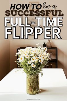 a vase filled with daisies sitting on top of a table next to a wall